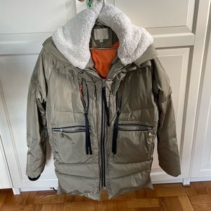 Orlay green coat, orange lining, fleece-lined hood, big zippered pockets.